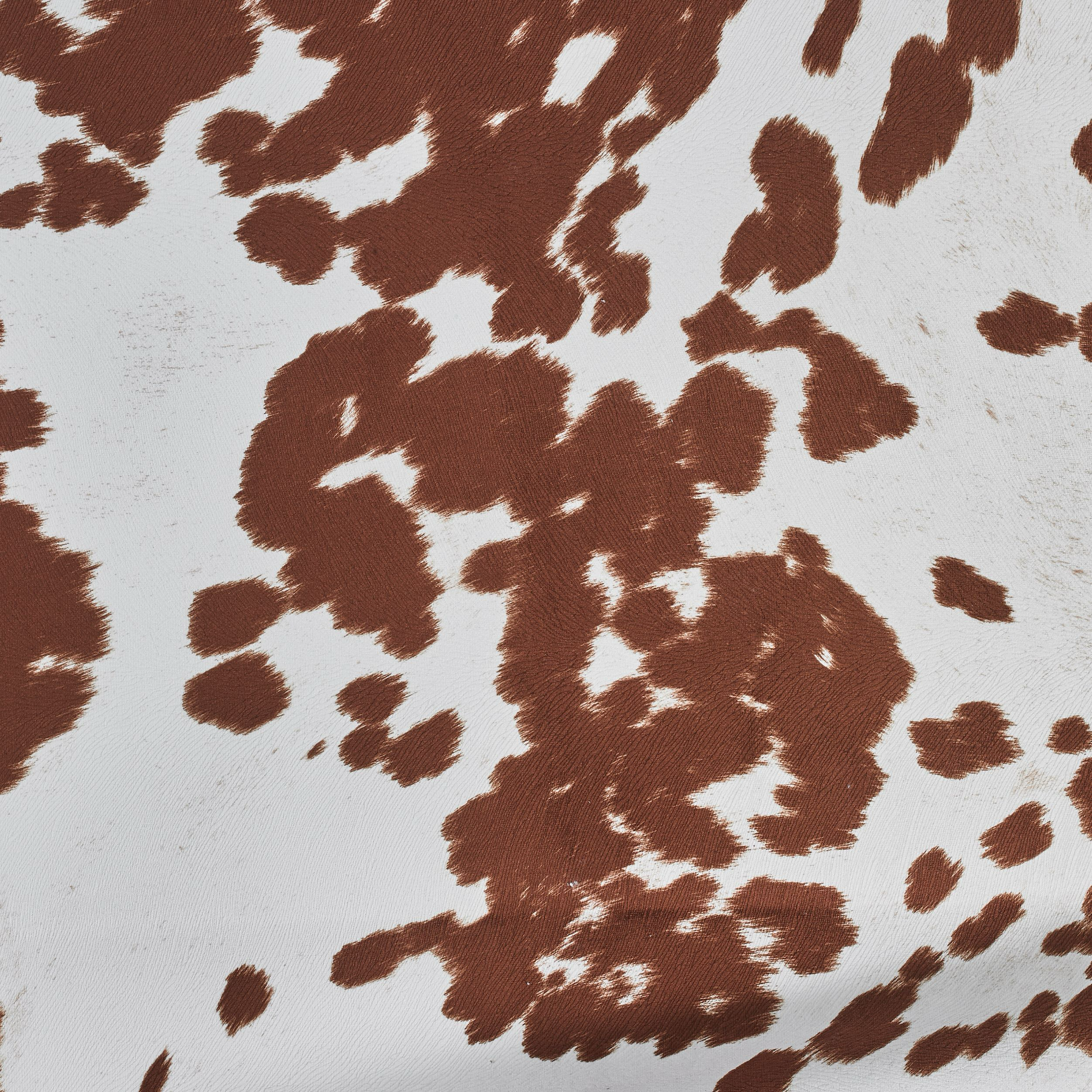 Close-up of brown and white abstract patterned fabric