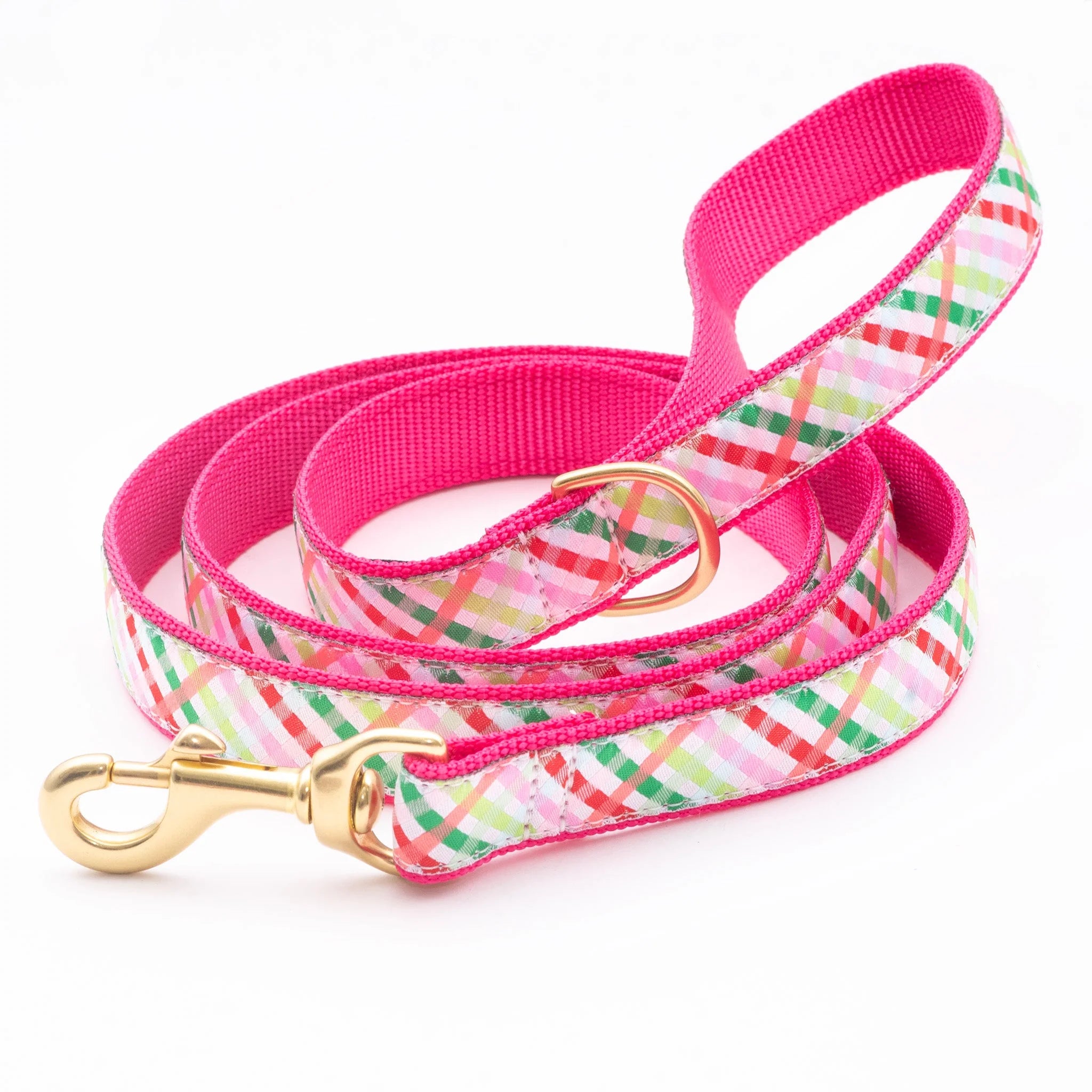 Dog leash with pink and multicolored plaid pattern on a white background