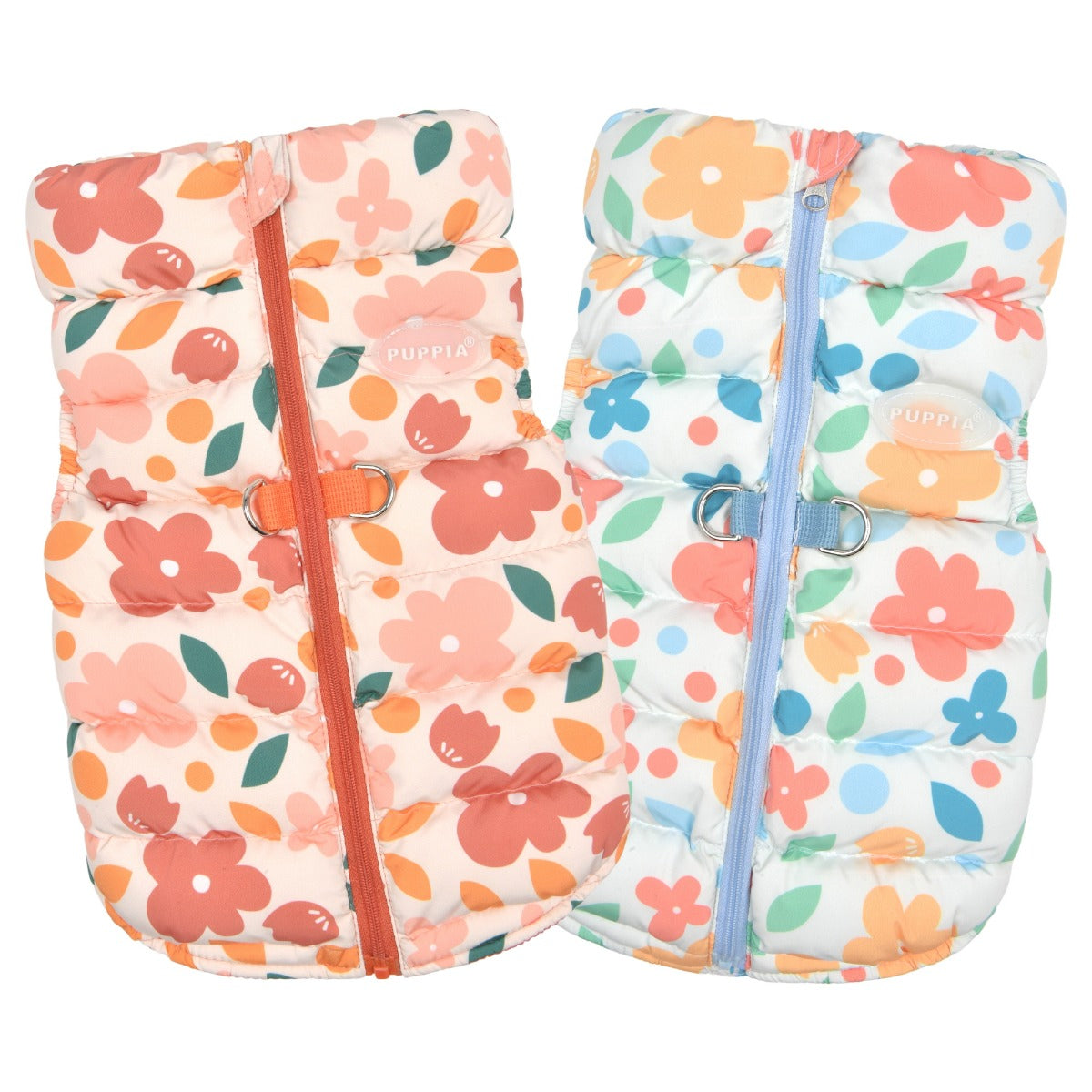 Two floral-patterned baby sleeping bags with zippers on a white background