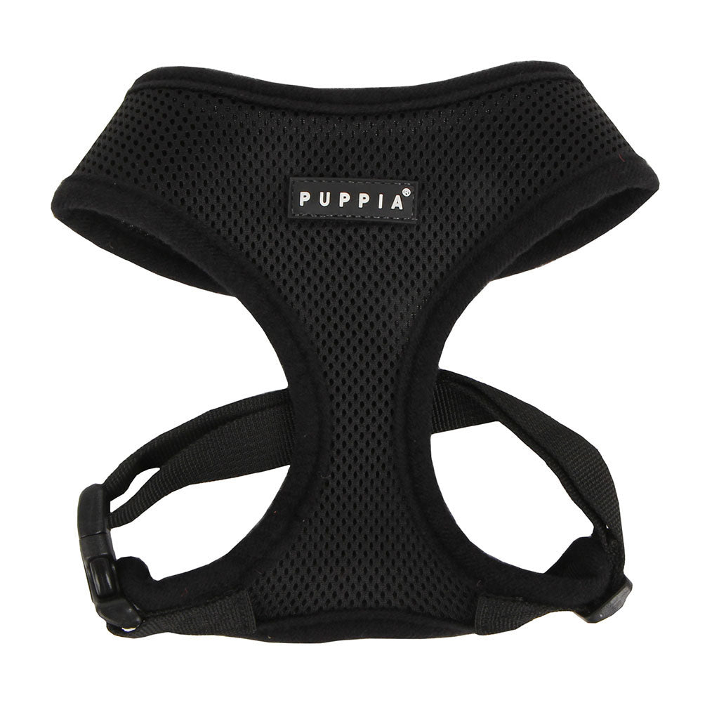 Black dog harness with Puppia logo on a white background