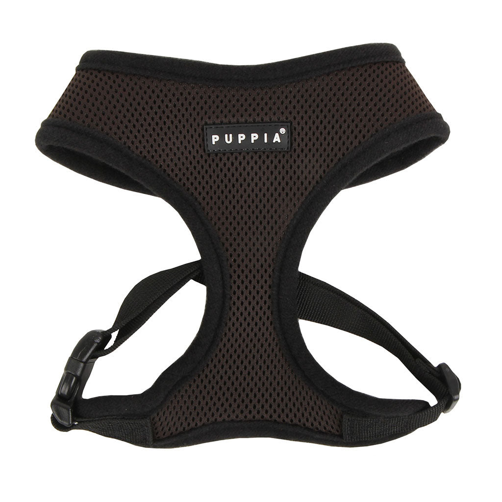 Black dog harness with Puppia logo on a white background