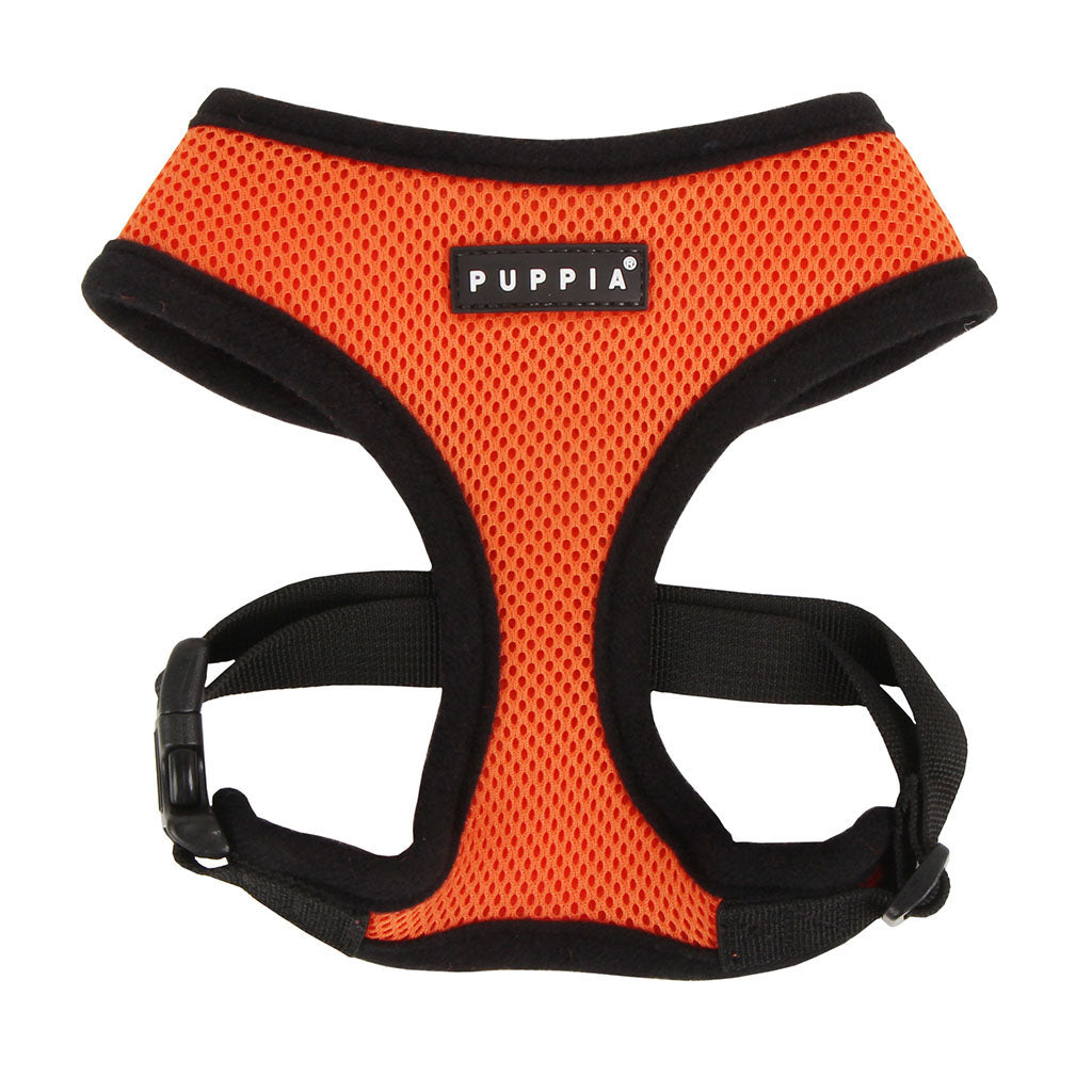 Orange dog harness with black straps on a white background, featuring the Puppia brand.