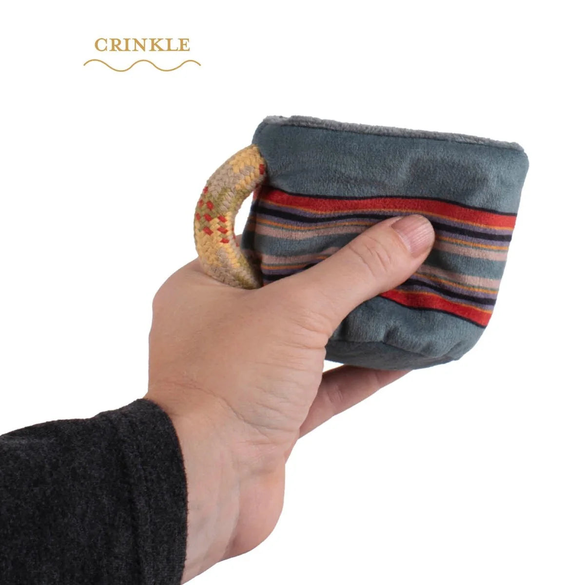 Hand holding a small fabric pouch with a striped pattern on a white background, branded 'Crinkle'.