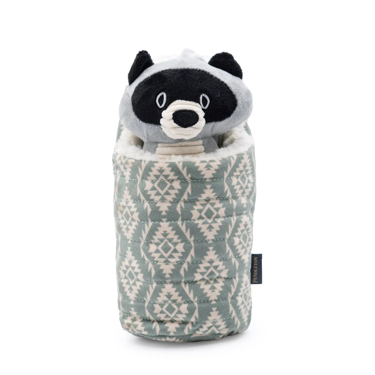Stuffed animal toy with raccoon design wrapped in a patterned bag on a white background