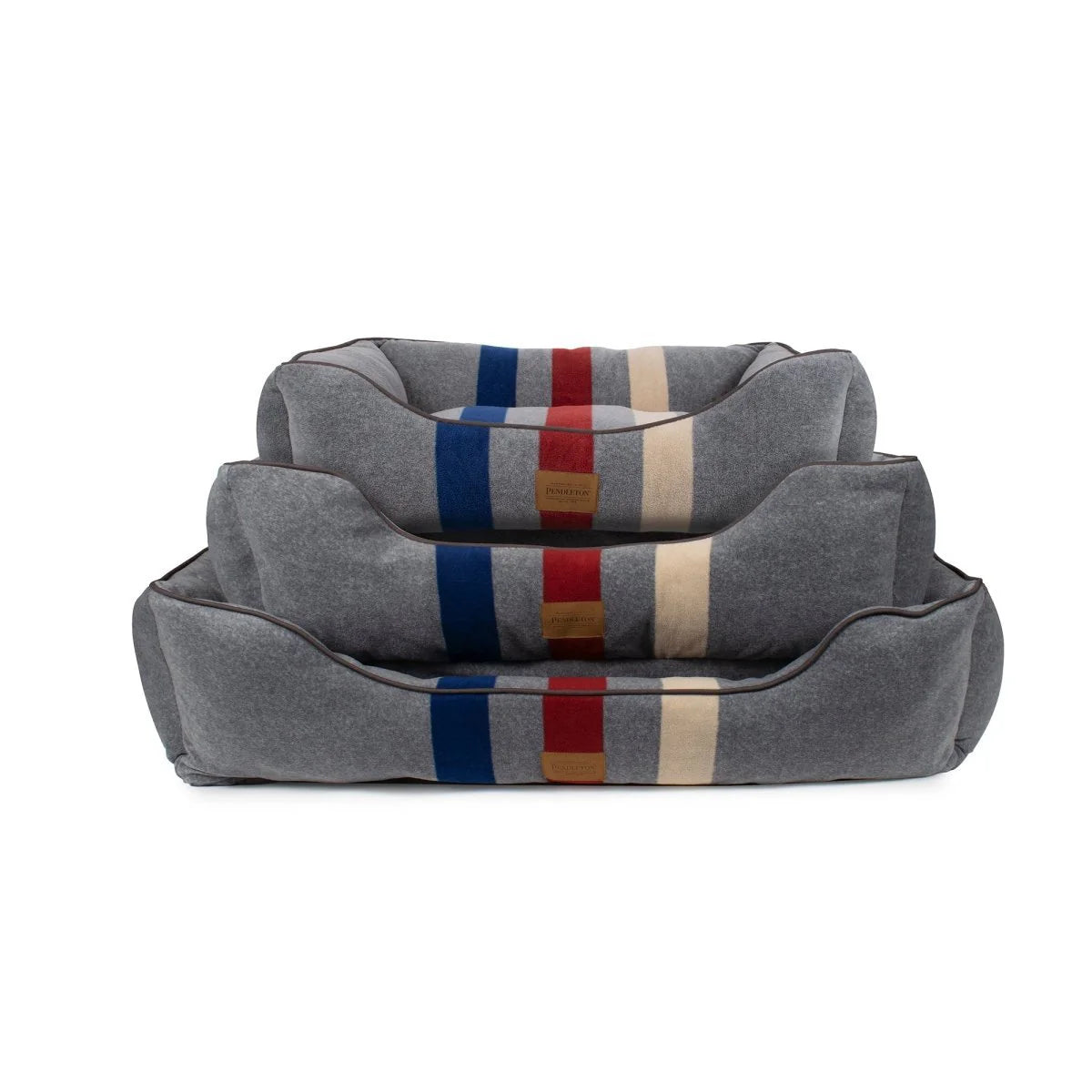 Gray pet bed with colorful stripes on a white background