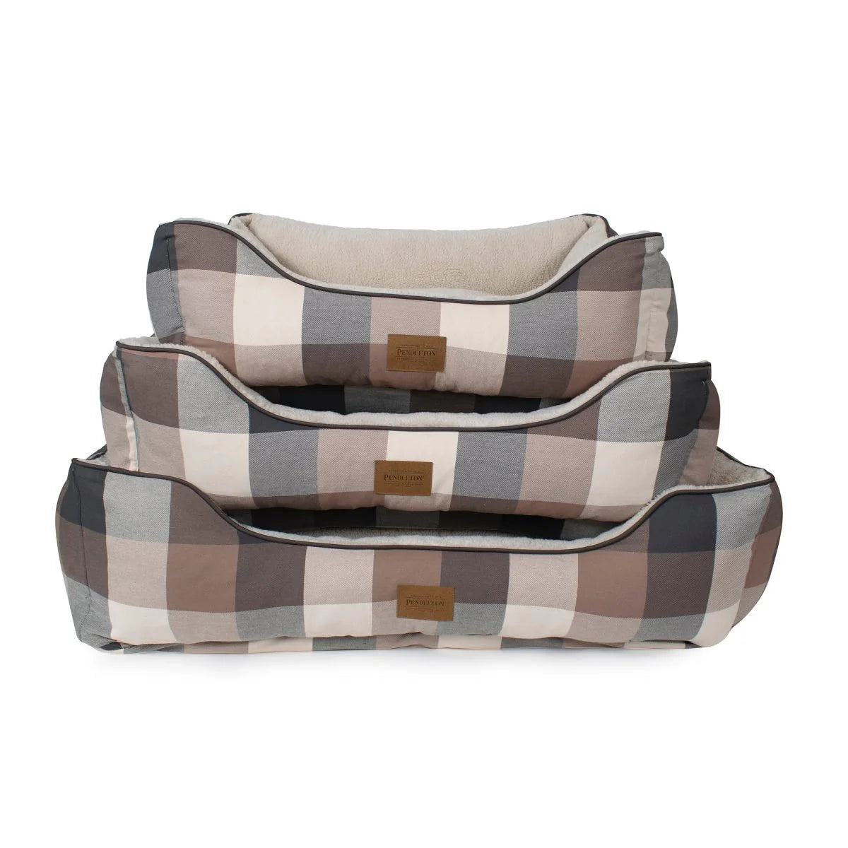 Set of three plaid-patterned pet beds on a white background