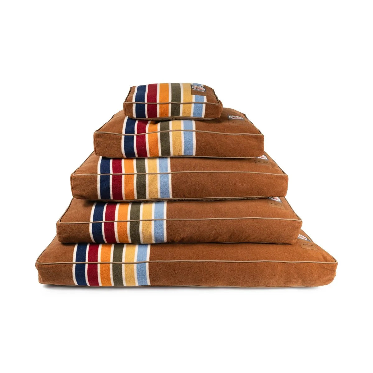 Stack of brown pet beds with striped patterns on a white background