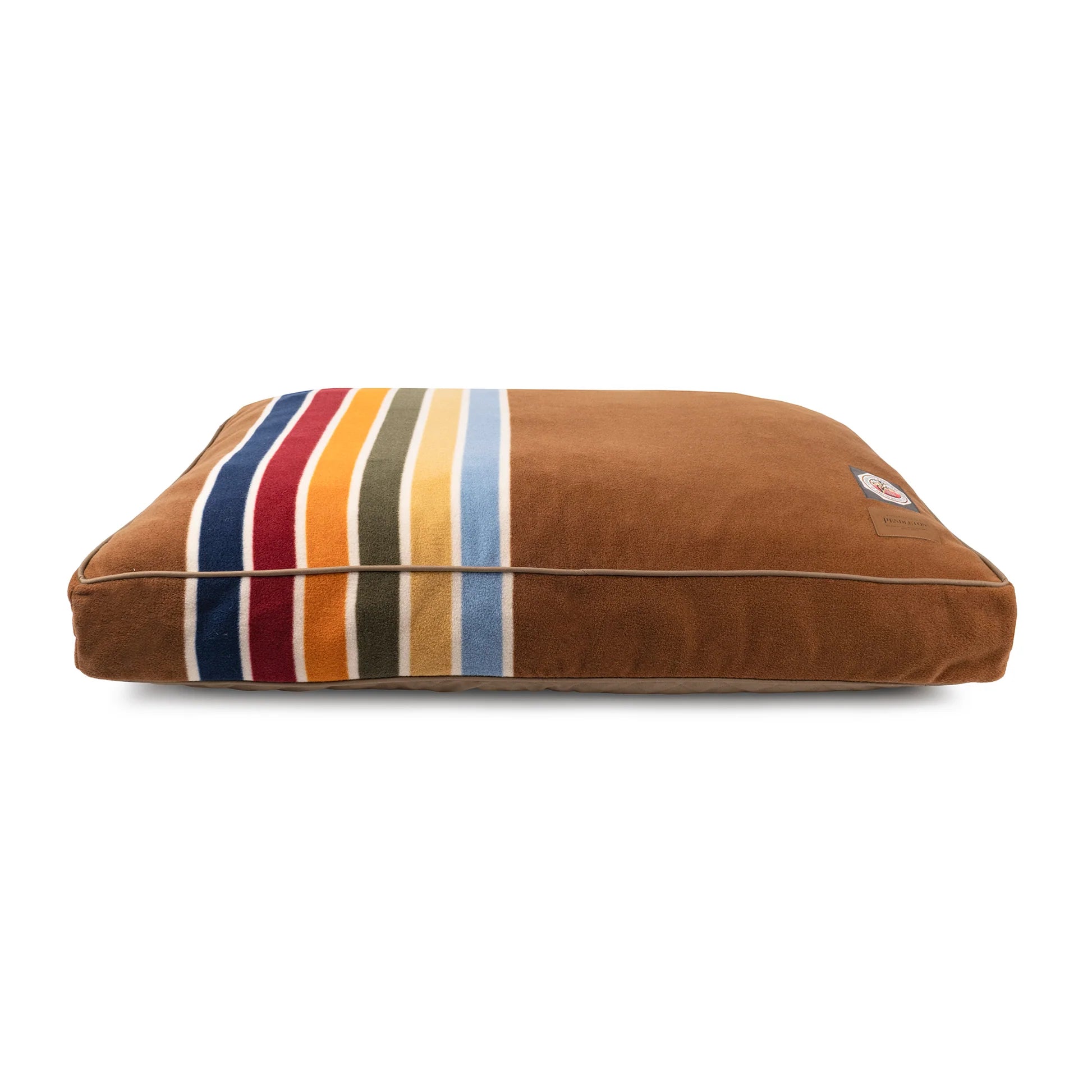 Brown pet bed with colorful striped pattern on a white background