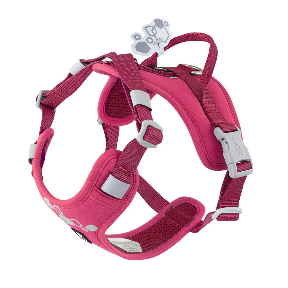Pink dog harness with white accents on a white background