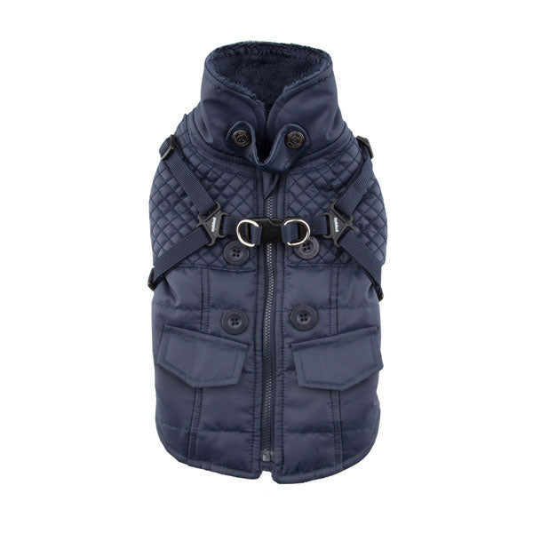 Navy blue quilted dog coat with harness on a white background