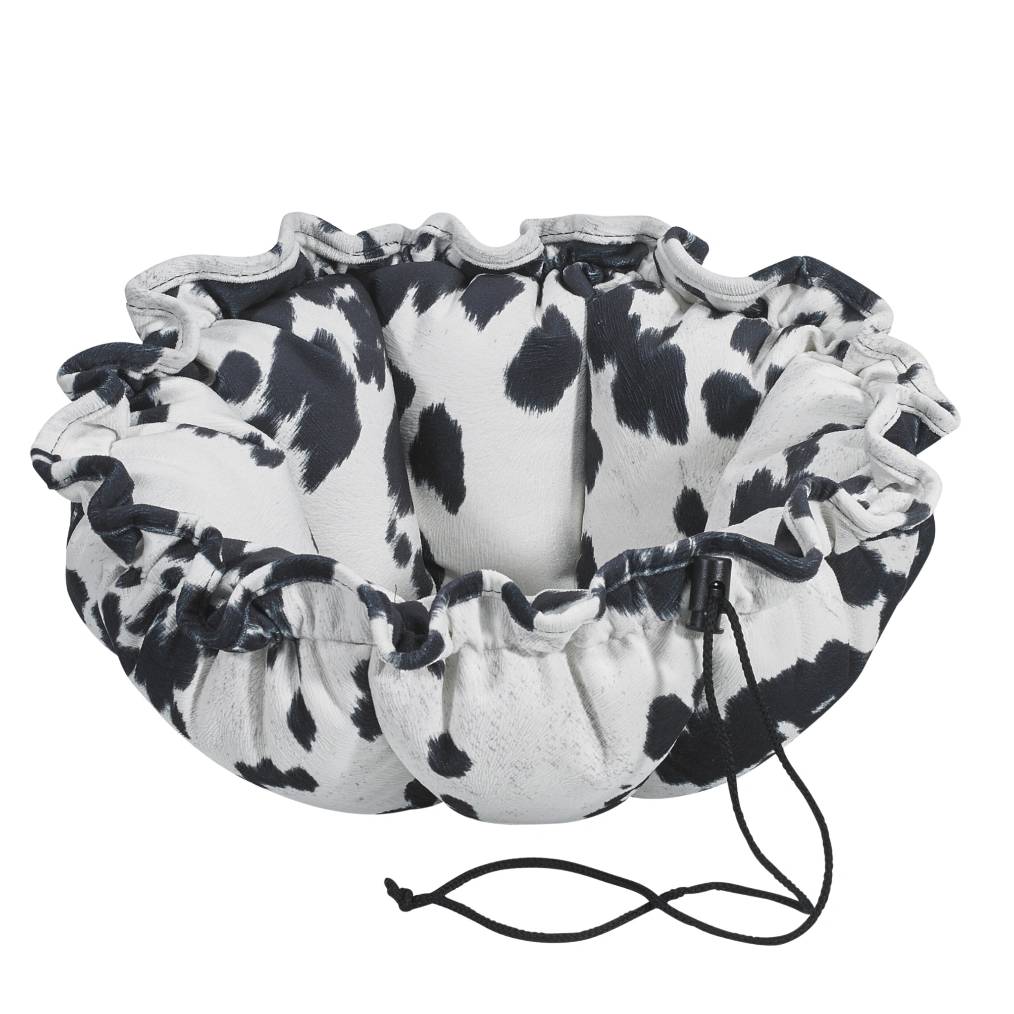 Cow print drawstring bag on a white background